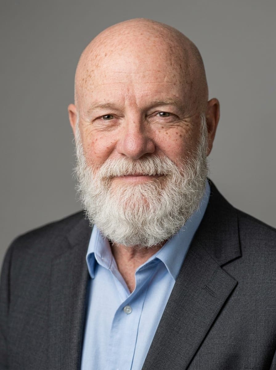 After: AI-generated example headshot — studio grey · charcoal suit